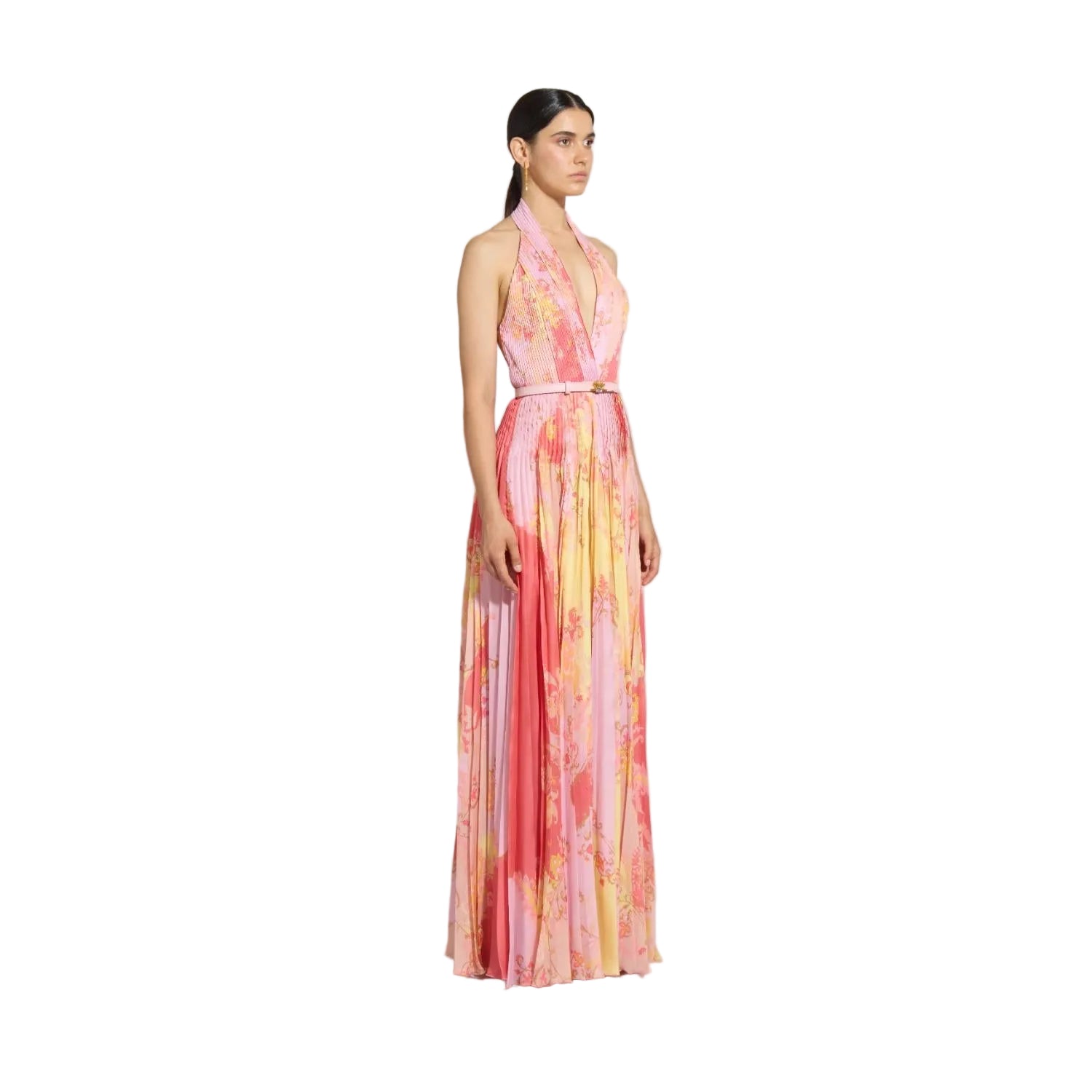 Three-quarter studio shot of a model showcasing the fluid movement, watercolor floral pattern, and accordion pleats of the pink multi Zuhair Murad halter evening gown.