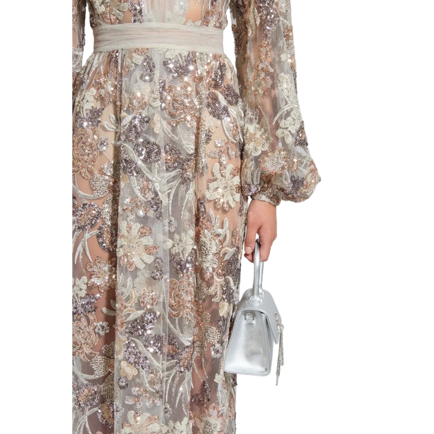Elegant dress with floral and sequin details held by a hand against a light gray background.