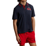 Navy blue short-sleeve polo with red collar and two navy stripes. Two-button placket, red embroidered polo player logo on che