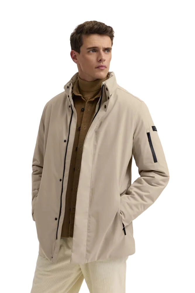 Beige men's jacket with a stand-up collar, snap-button placket, and multiple black zip pockets.