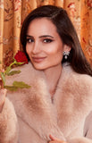 Front view of the Santinni Grand Duchess earrings featuring a pavé crystal bow and pear drop