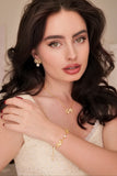 Model wearing the Sissi Bow and Pearl earrings to show scale and drape.