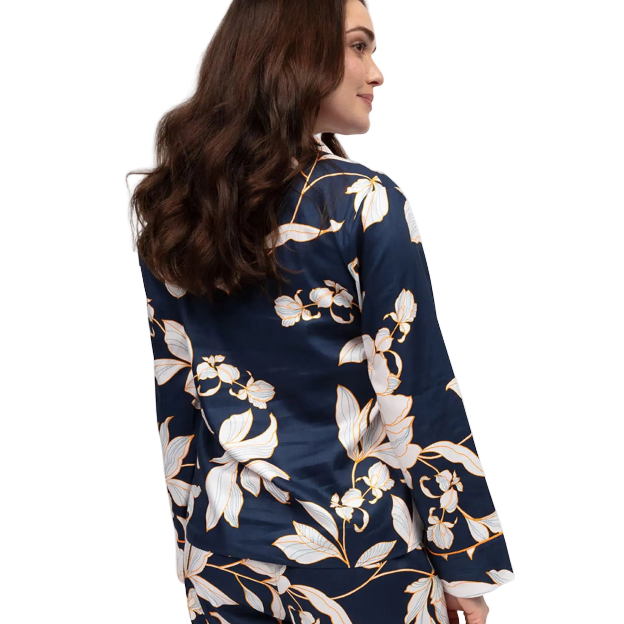 Navy blue long-sleeved pyjama top with white and gold-toned floral print, visible collar and cuffs.