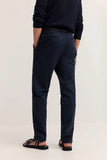 Navy blue casual trousers with a straight fit and smooth material. Features two back pockets, one with a visible dark button.