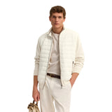 Ecru men's knitted and quilted jacket with a stand-up collar, full-zip front, and ribbed trims.