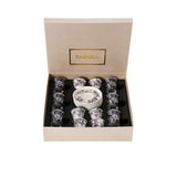 Perspective view of the open Casa Blu gift box displaying the organized 18-piece floral set.