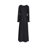 Back view of the CASA JOHARA FASHION black maxi dress showing the long zipper closure and floor-length hem.