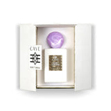 Abercrombie & Fitch Cave Essential Secret Tuberose luxury parfum bottle with white finish, gold label, and purple marbled cap.
