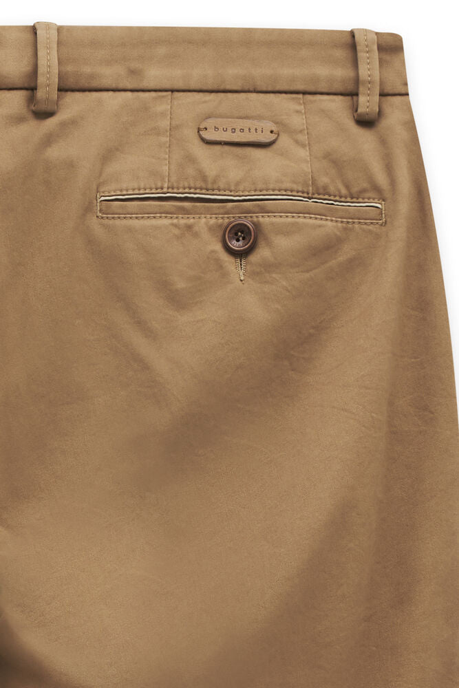 Tan trousers, back view, with belt loops, a 'bugatti' patch, and a welt pocket with a white stripe and brown button.