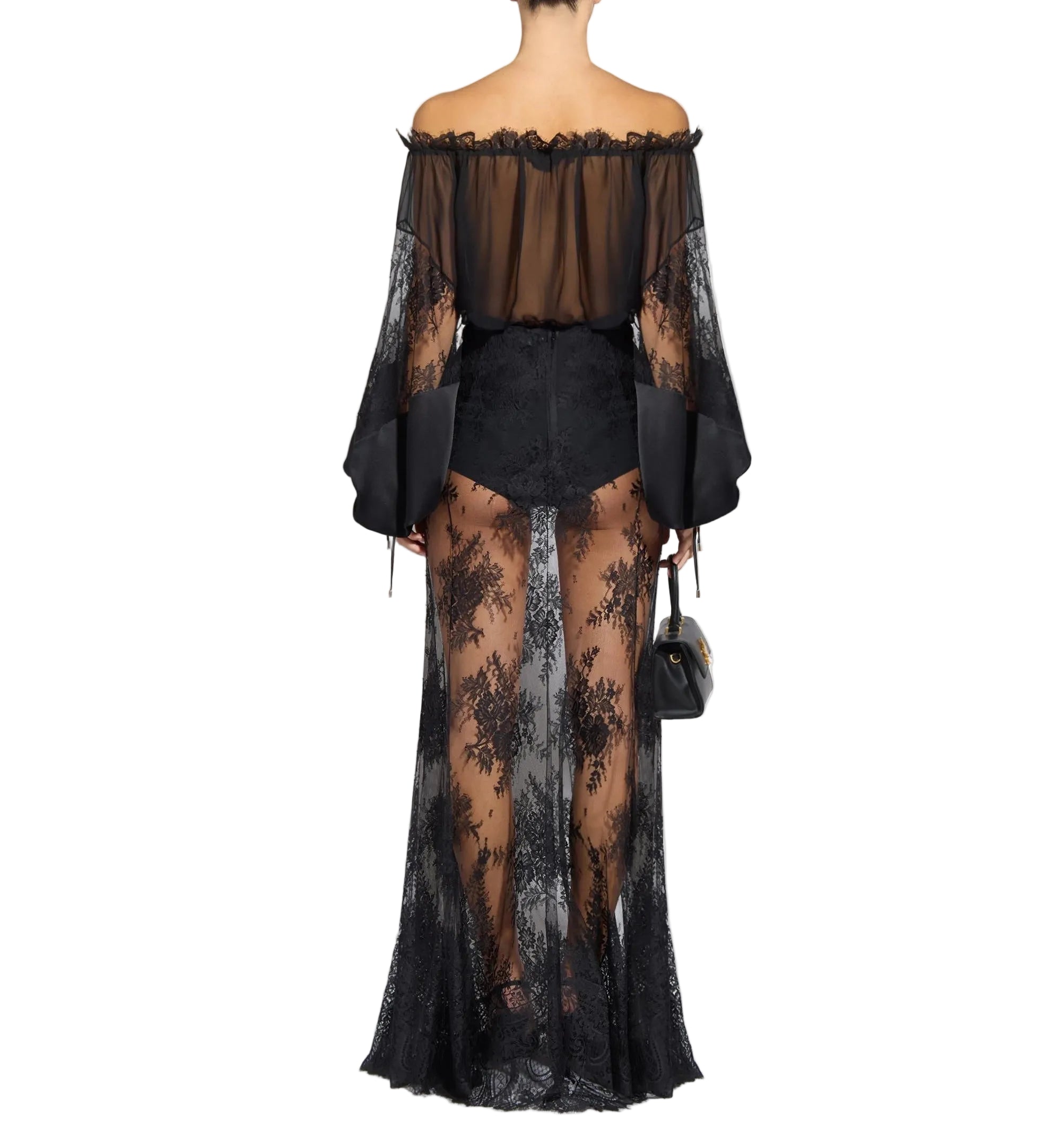 Black sheer off-shoulder blouse with lace bell sleeves and ruffled trim. High-waisted sheer floral lace maxi skirt with opaqu