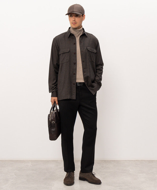 Dark brown, textured sport jacket with a shirt collar, full button-front closure, and two chest pockets with buttoned flaps.