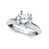 Silver-toned plated ring with a large, round, clear brilliant-cut cubic zirconia stone in a six-prong setting.