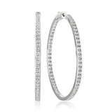 Pair of large silver-toned hoop earrings, each embellished with rows of clear, sparkling cubic zirconia stones on both inner