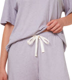 close-up view of model wearing the Triumph light purple pajama set, highlighting the soft-touch fabric and comfortable drawstring trousers. Order Online Today