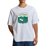 White La Martina men's t-shirt with a green and beige shield graphic on the chest and a small green embroidered logo on the l