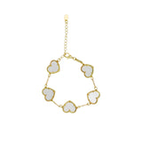 Girls' gold-tone bracelet featuring five white pearlescent heart charms on a white background.