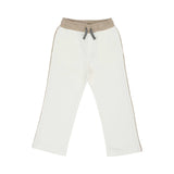 Close-up of the off-white joggers featuring a contrast sand-colored waistband and grey drawstring.