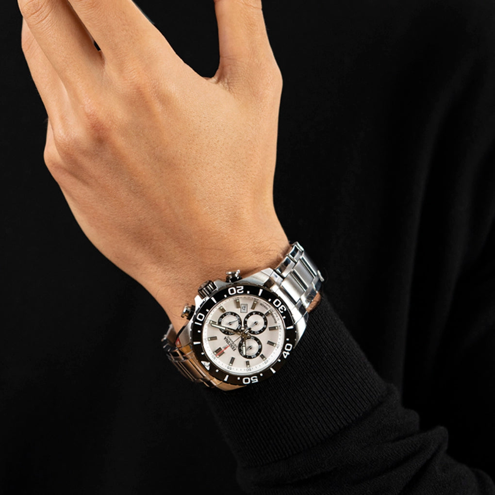 Men's silver-toned stainless steel watch with a white dial, three black sub-dials, and a black bezel with white markers.