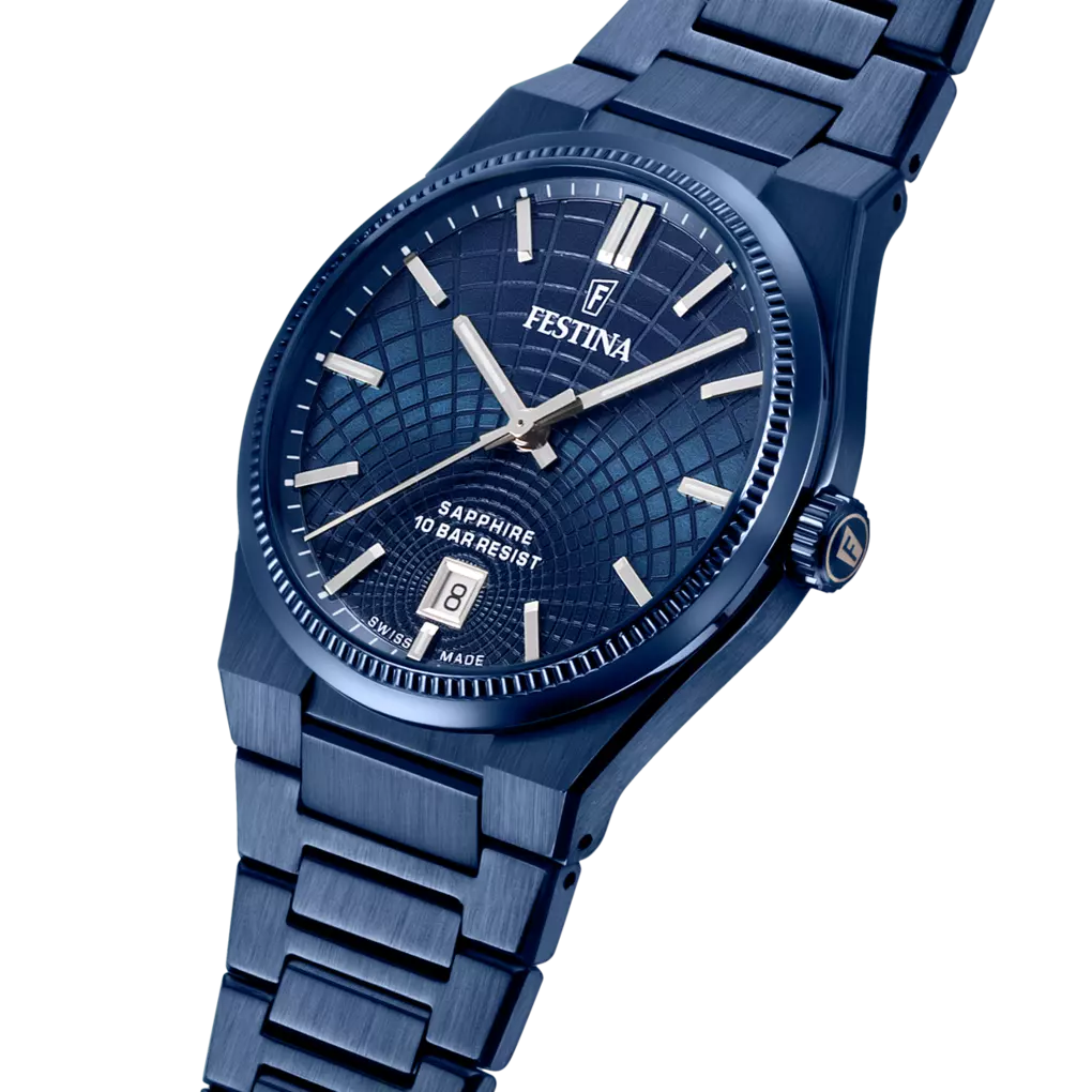 Dark blue brushed metal watch with textured dial, silver-toned hands and markers, date window, and fluted bezel. Gold-toned F