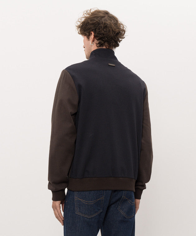 Two-toned sweater with a very dark brown body and deep brown sleeves. Stand-up collar, ribbed cuffs/hem. Small dark tag on ba