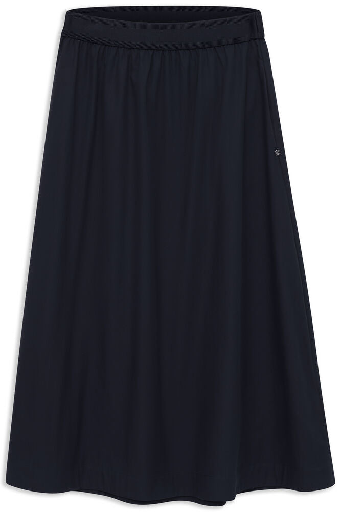 Navy blue long skirt with a ribbed elastic waistband and subtle vertical texture. A small silver-toned emblem is on the right