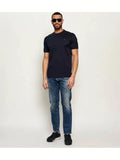 Midnight blue short-sleeved crewneck t-shirt with a subtle dark emblem on the left chest.