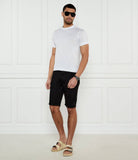 White crewneck t-shirt with short sleeves and a subtle light-colored logo on the left chest.