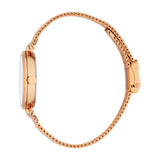 Rose gold-toned watch with a round case, white dial, and a mesh strap with an adjustable clasp, viewed from the side.