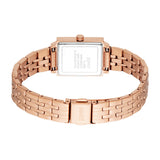 Rose gold-toned rectangular watch with a metal link bracelet. The silver-toned case back has engraved text.