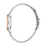 Silver-toned watch with a rose-gold-toned bezel and a silver-toned metal link bracelet with a clasp, viewed from the side.