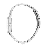 Silver-toned watch with a white face, crystal-studded bezel, and a silver-toned link bracelet with a visible clasp.