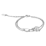 Silver-toned double chain bracelet with a polished animal head charm and an oval white opaque stone.