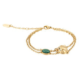 Gold-toned double-chain bracelet with a prominent gold-toned animal head motif and an oval green stone-like inlay.