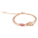 Rose gold-toned double chain bracelet with a pink oval stone and a stylised rose gold-toned animal head charm.