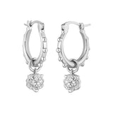Pair of silver-toned hoop earrings with small studs on the outer edge and a dangling tiger head charm.