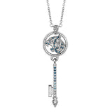 Silver-toned chain necklace with a key-shaped pendant. The circular top features a tiger head motif with blue and clear cryst