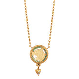 Gold-toned chain necklace with circular tiger head pendant, green gemstones, and dangling conical element with clear gemstone