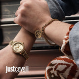 Gold-toned curb chain bracelet with a circular charm featuring a tiger's head design outlined with clear stones.
