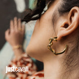 A single gold-toned hoop earring featuring a textured snake design that wraps around the upper curve, creating an intertwined