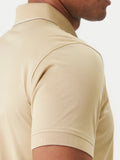 Sand-colored polo shirt with ribbed collar and sleeve cuffs. Features a thin dark stripe along the inner collar.
