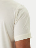 Champagne short-sleeved polo shirt with smooth fabric and ribbed sleeve cuff.