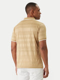 Camel short-sleeved polo shirt with a ribbed collar and cuffs, both featuring a white stripe. The shirt body has subtle horiz
