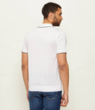 White short-sleeved polo shirt with black trim on the collar and sleeve cuffs, and a ribbed hem, seen from the back.