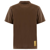 Brown short-sleeved polo shirt, back view. Features a collar and a light brown fabric label on the lower right back.