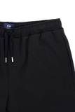 Black bermuda shorts with an elasticated waistband, black drawstring with silver-toned tips, and a vertical slit pocket.