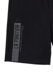 Black shorts with a grey vertical stripe. Features 'LA MARTINA', polo logo, and 'EMIRATES WORLD CHAMPIONSHIP 20.26'.