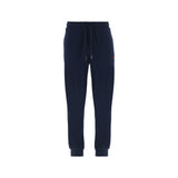 Navy blue jogging pants with an elasticated drawstring waist, silver-toned aglets, ribbed cuffs, and a small red embroidered