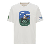 Optic white crew neck t-shirt with a central graphic of a polo player on a horse. Green 'L' on left sleeve, blue 'Cap' on rig