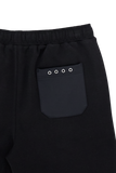 Black shorts with an elastic waistband and a back patch pocket featuring four silver-toned eyelets.