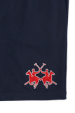 Navy blue Bermuda shorts with a red and white embroidered logo of two polo players on horseback with crossed mallets.